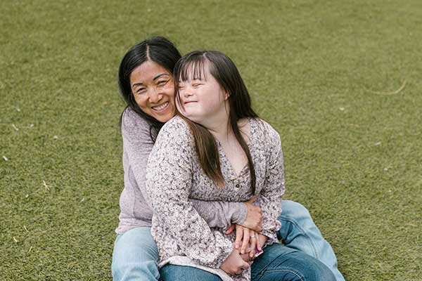 smiling mother and daughter